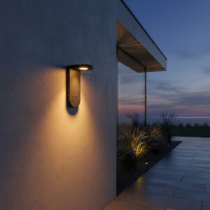 Modern black outdoor wall light with warm COB LED glow on a luxury house exterior at dusk, accenting a patio area.
