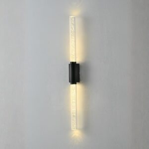 Modern outdoor 6W LED wall light with bubble glass diffuser, casting warm up and down light on a luxury home's exterior wall at night.