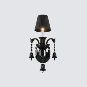 Elegant black crystal wall lamp with three lights and dark shades on a classic brown living room wall, featuring a decorative fireplace and armchair.