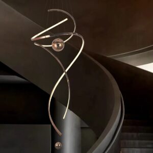 Modern spiral LED pendant light for high ceilings with metallic finish and spherical accents in a contemporary home foyer