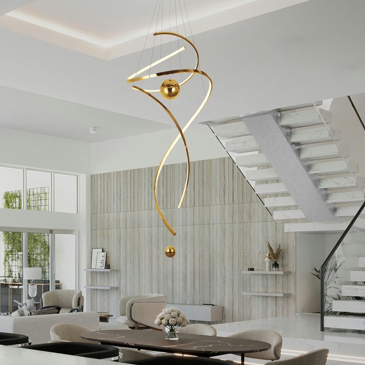 Modern spiral LED pendant light for high ceilings with metallic finish and spherical accents in a contemporary home foyer