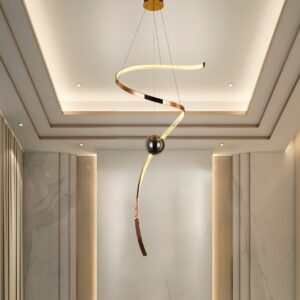 Modern spiral LED pendant light for high ceilings with metallic finish and spherical accents in a contemporary home foyer