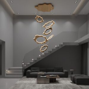 Modern gold LED chandelier in a high-ceiling luxury living room, illuminating a staircase and sofa with a warm glow.