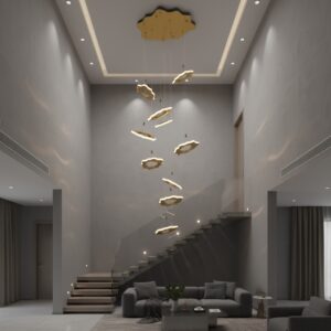 Luxury modern high ceiling living area with staircase and a large gold cloud-design pendant chandelier.